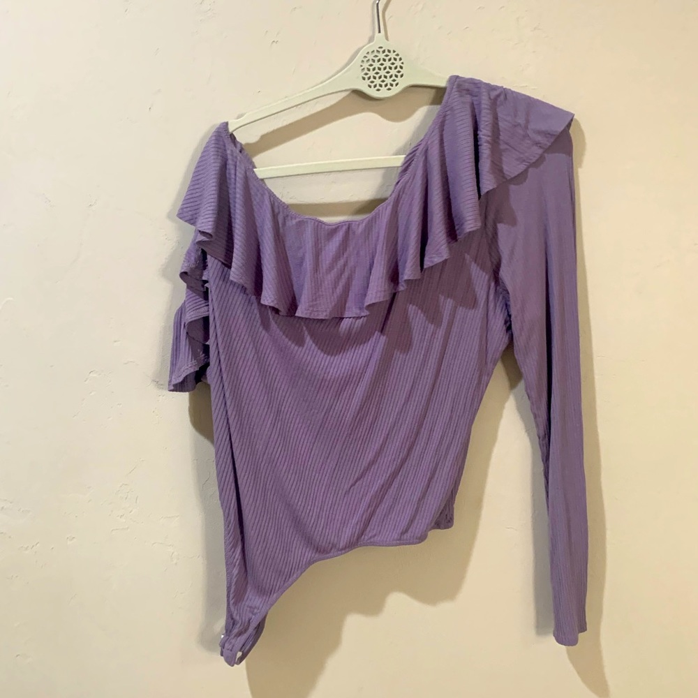Lavender bodysuit. Ruffled.